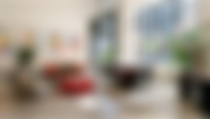 interior photo of block community hub with art on the wall and seating area