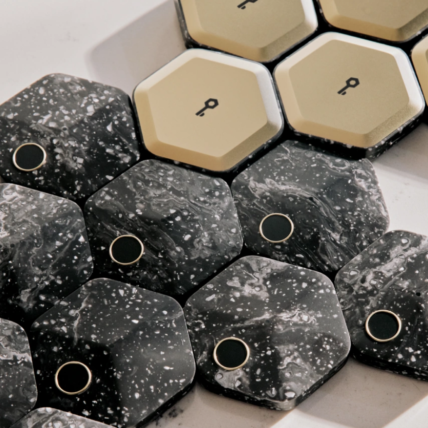 An array of hexagonal-shaped Bitkey hardware products.