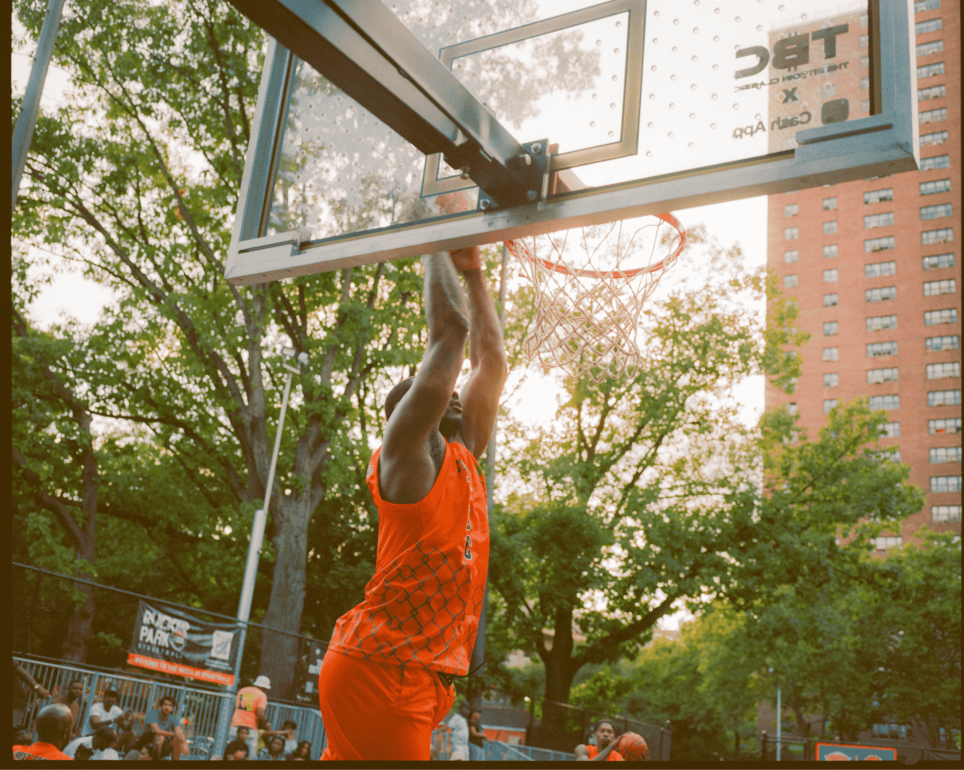 Person playing basketball on an outdoor court