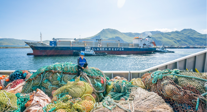 Piles of fishing nets in a boat.