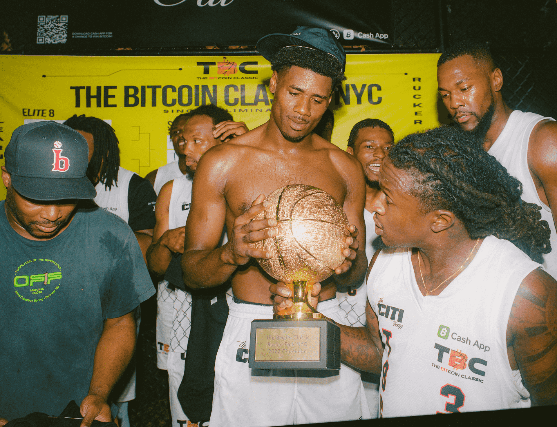 Person holding a basketball trophy