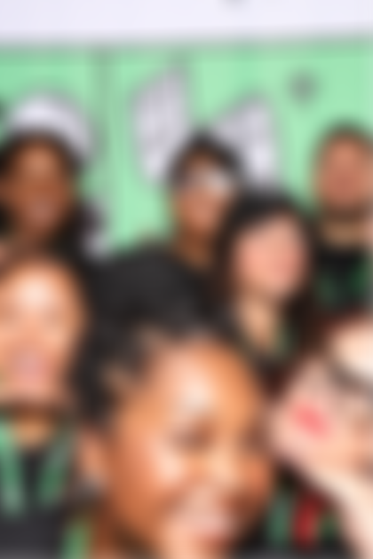 A group of people posing for a photo at the Bitcoin 2023 conference.