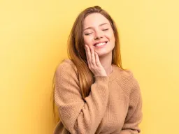 Young woman smiling with clear skin after Advanced BHA Lift peeling treatment, showing healthy and fresh complexion
