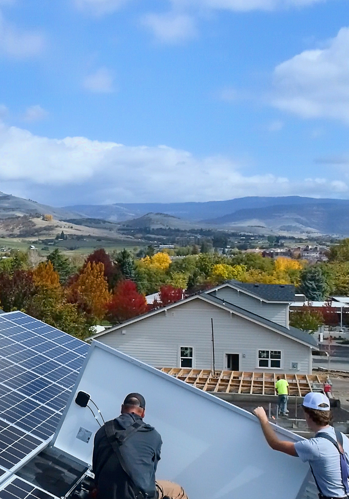 Professional installers on a rooftop array