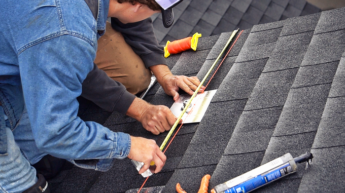 Installer wiring a rooftop array