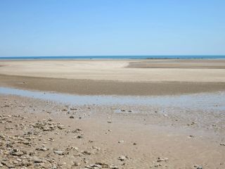Sand and lots of sand at low tide at Casuarina Nude Beach
