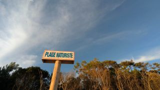 Sign at Plage Naturiste de la Lède