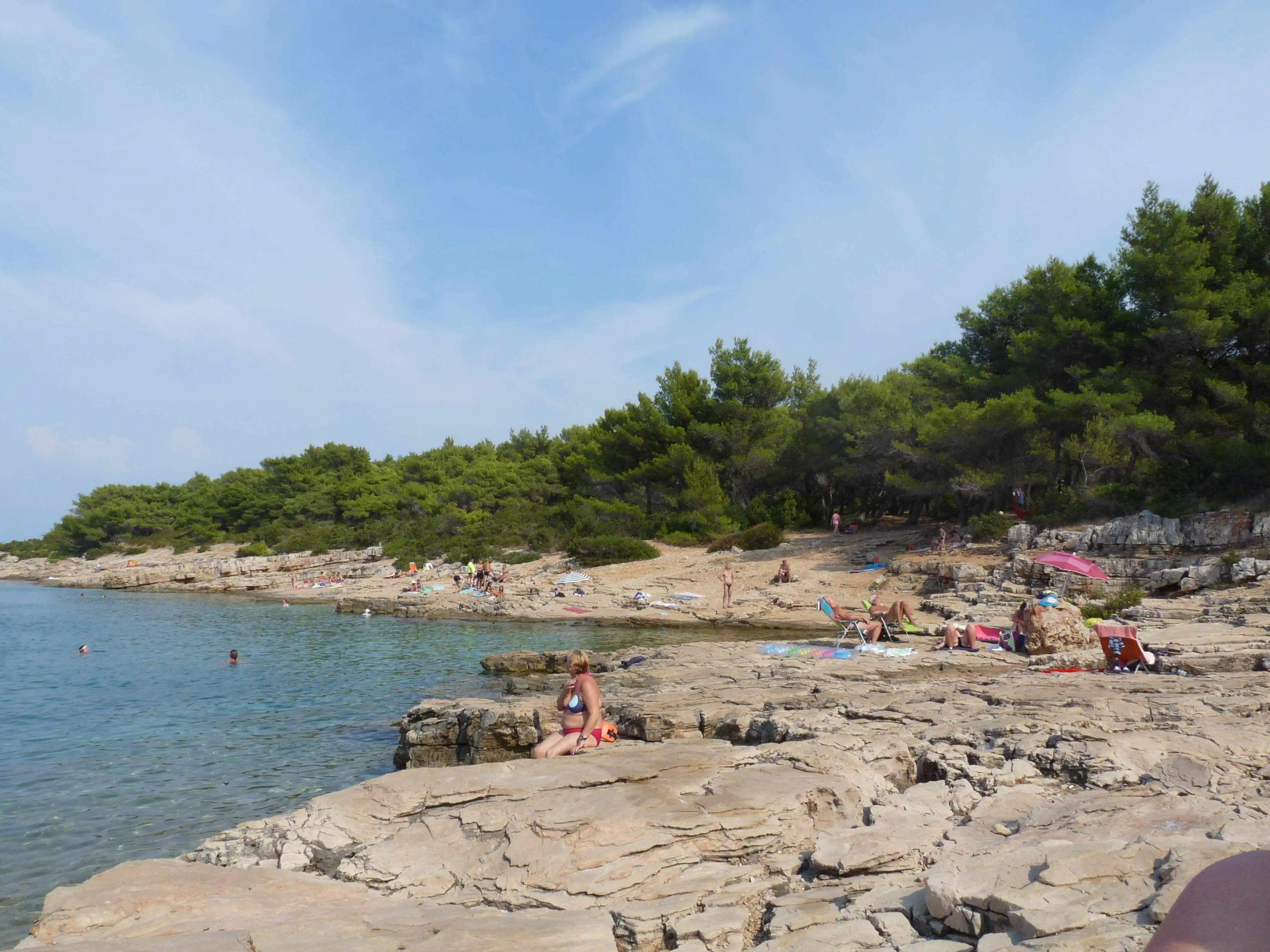 The beach attracts at mixed crowd of textiles and nudists most days.