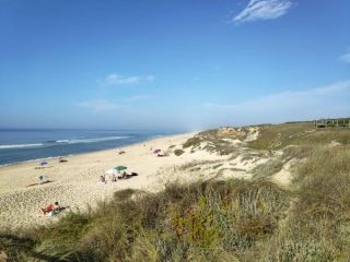 View of stunning Praia das Pedras Negras in Portugal