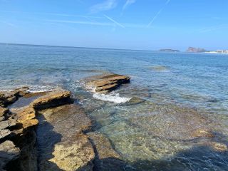Rock shoreline but away from the crowds at Plage du Liouquet naturiste