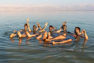 Mud soak at Metsoke Dragot Naturist Beach
