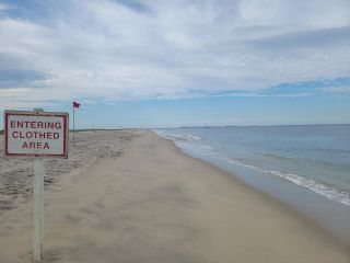 The end of the nude section at Gunnison Nude Beach. However on busy days you're likely to see people sans clothing past this sign!