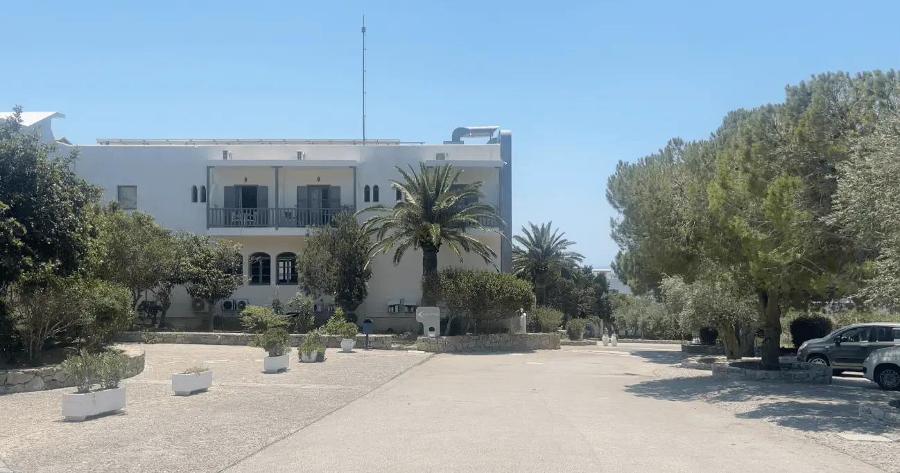 The entry to Vritomartis Naturist Resort with plenty of parking to the right