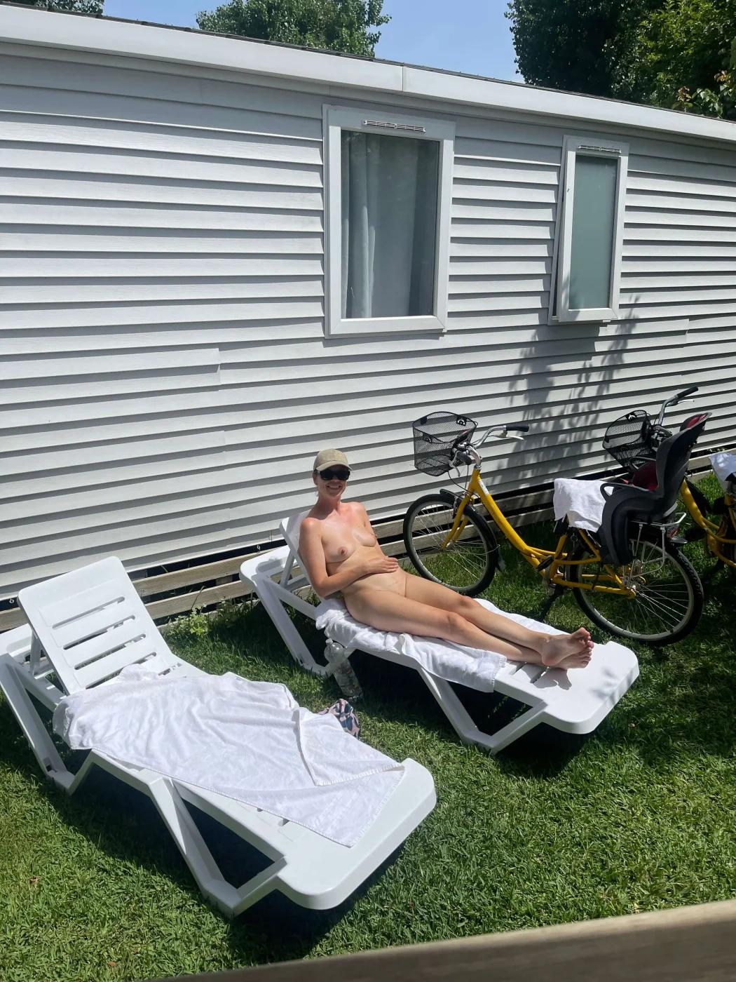 Person tanning area outside the cabins