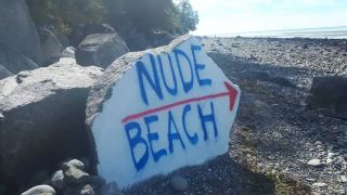 The painted rock is a little faded now but still points in the right direction!
