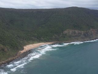 The beach surrounded by bushland at Werrong Beach