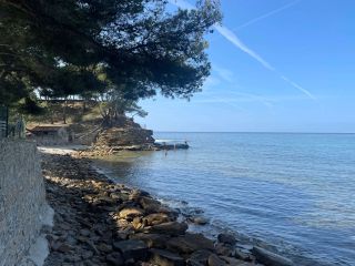 View of the main beach at Plage du Liouquet (naturist section is to the far left over the rocks)
