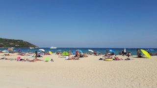 A busy summer day next to the nude section at Plage de Pampelonne