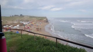 The grassy area is always available if the sand is too crowded at Playa Escondida