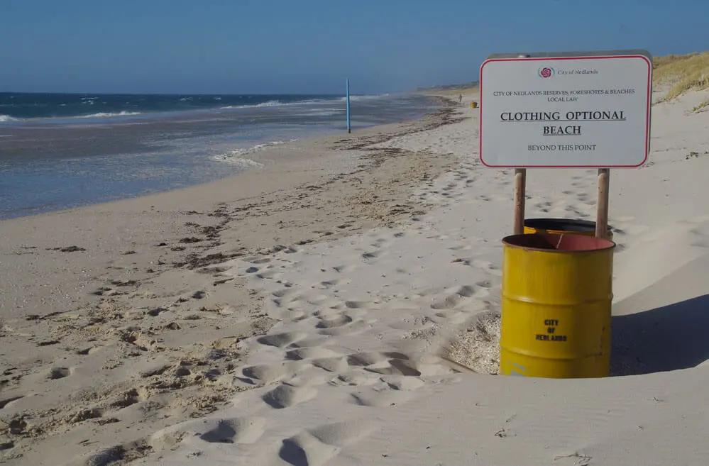 Signage marks the nude section! However you might see people undressed before this sign