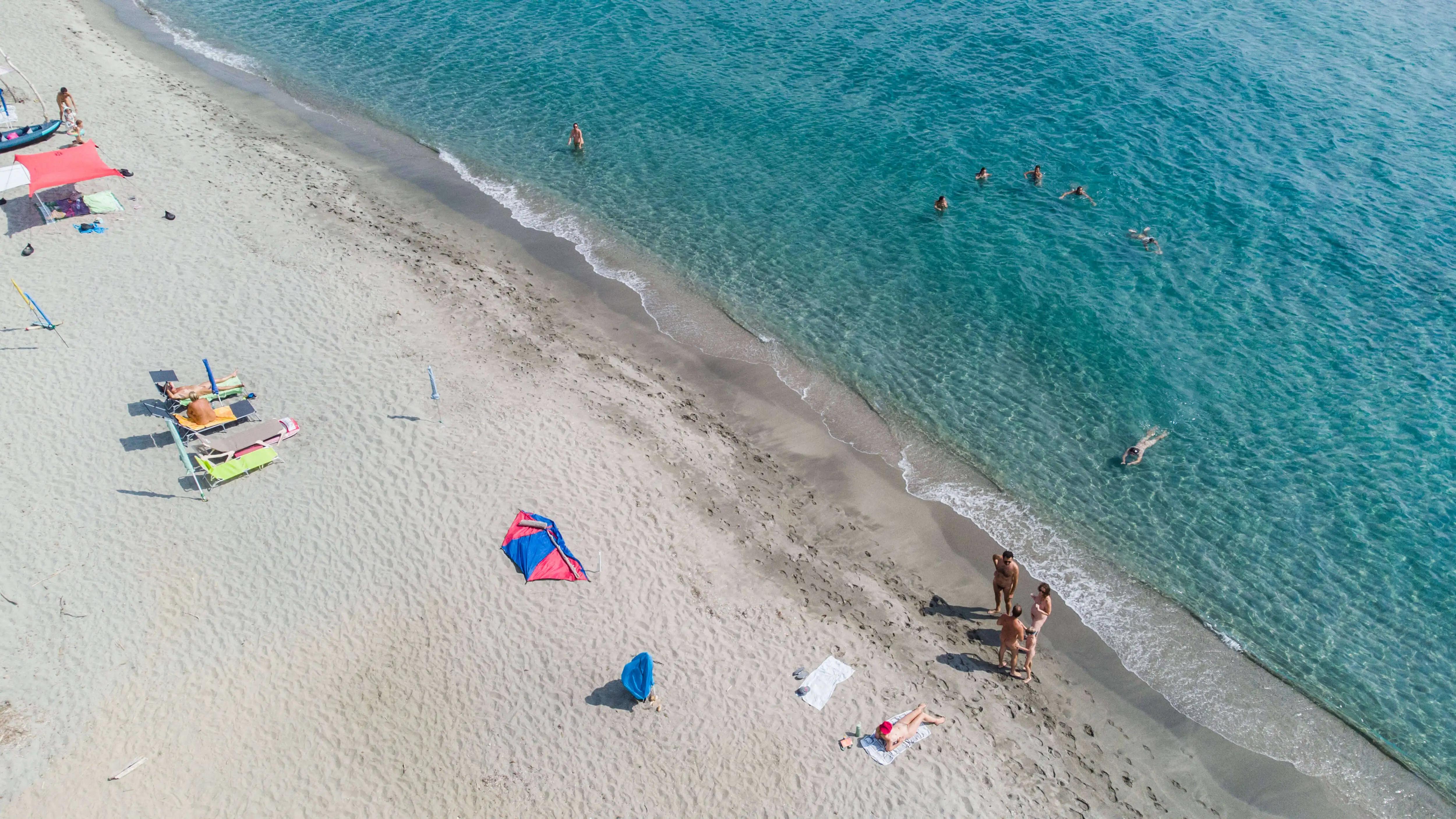 Soft sand and crystal clear water at Domaine Naturiste de Riva Bella
