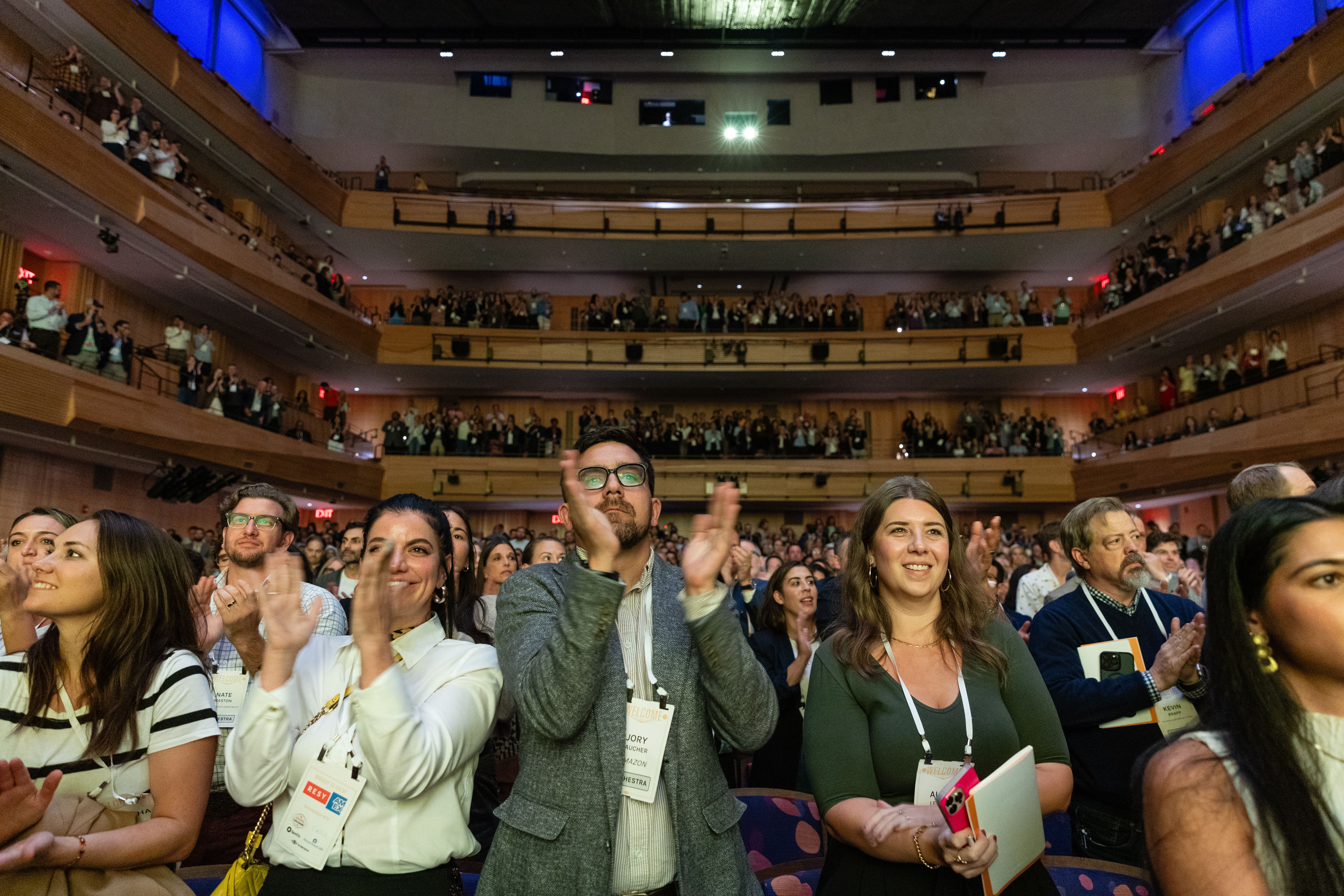 Audience at the Welcome Conference standing and applauding