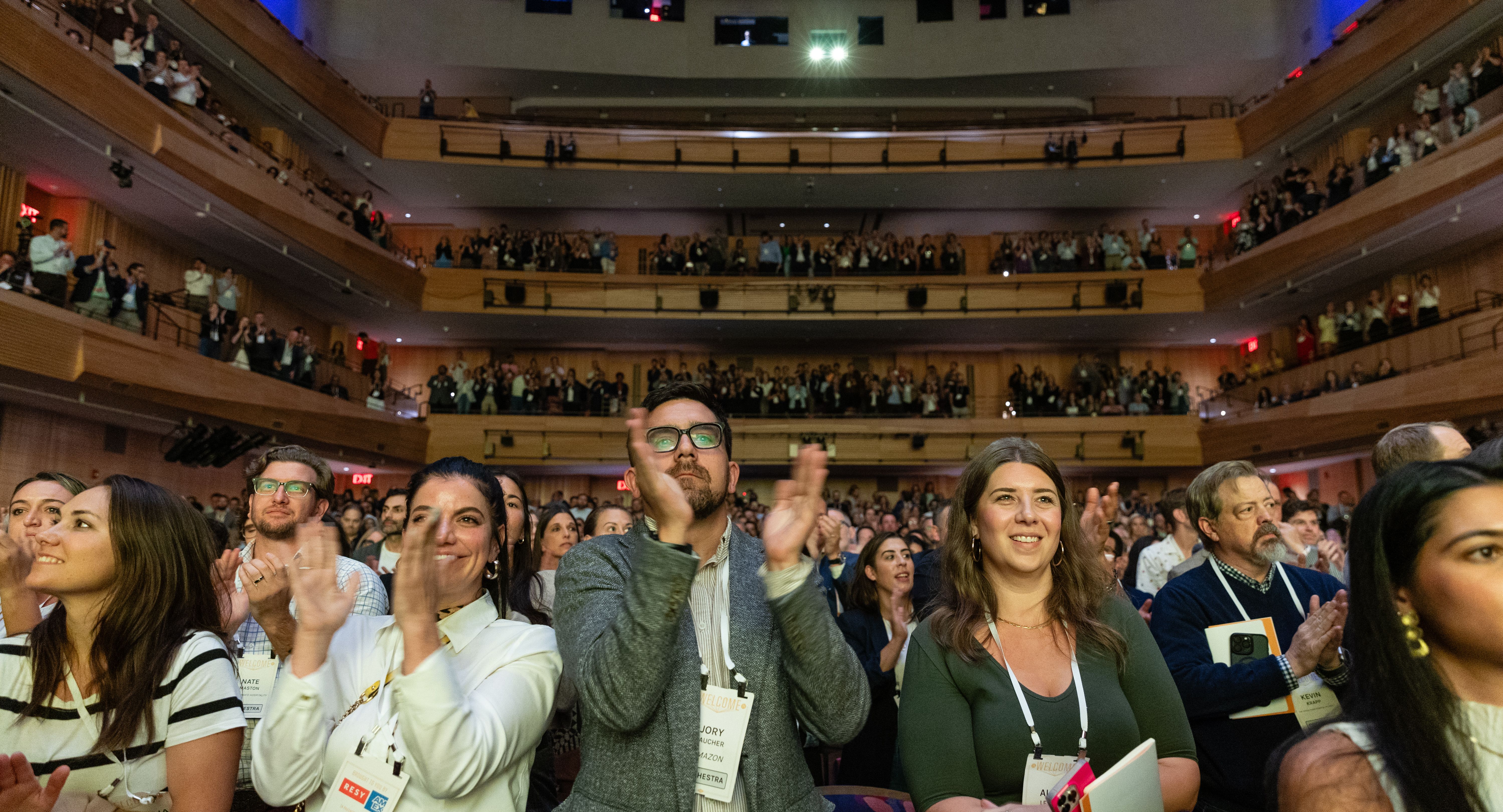 Audience at the Welcome Conference standing and applauding
