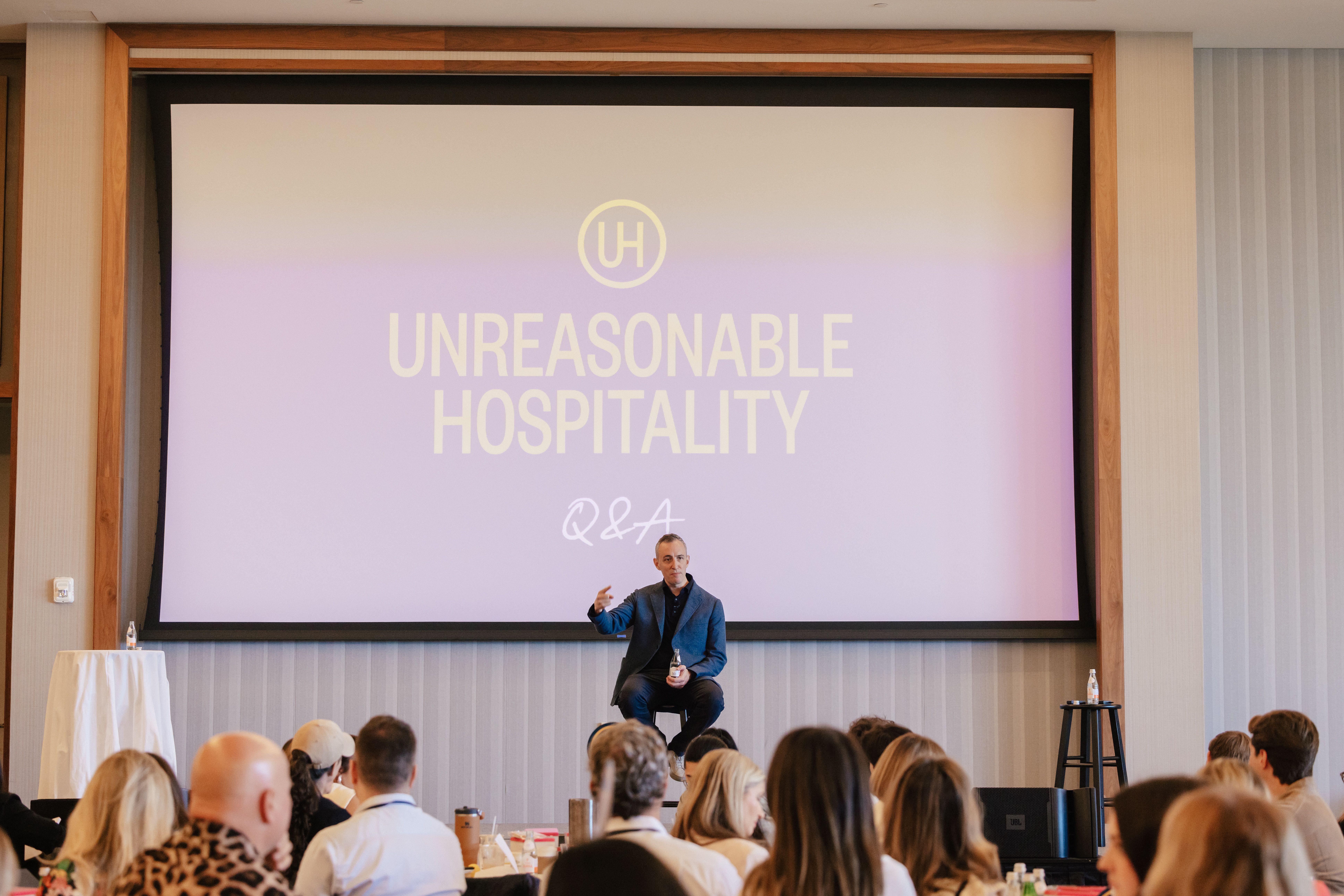 Will Guidara onstage at The Summit