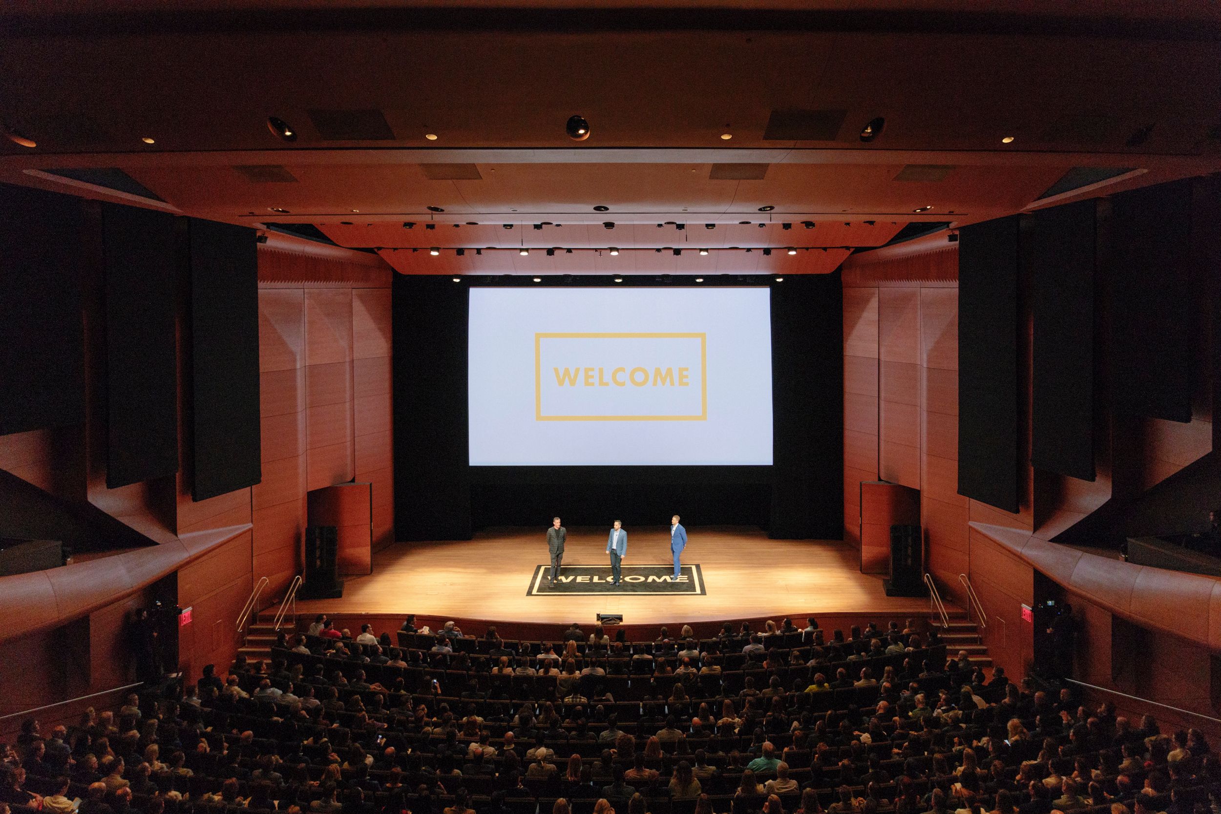 3 speakers onstage at The Welcome Conference