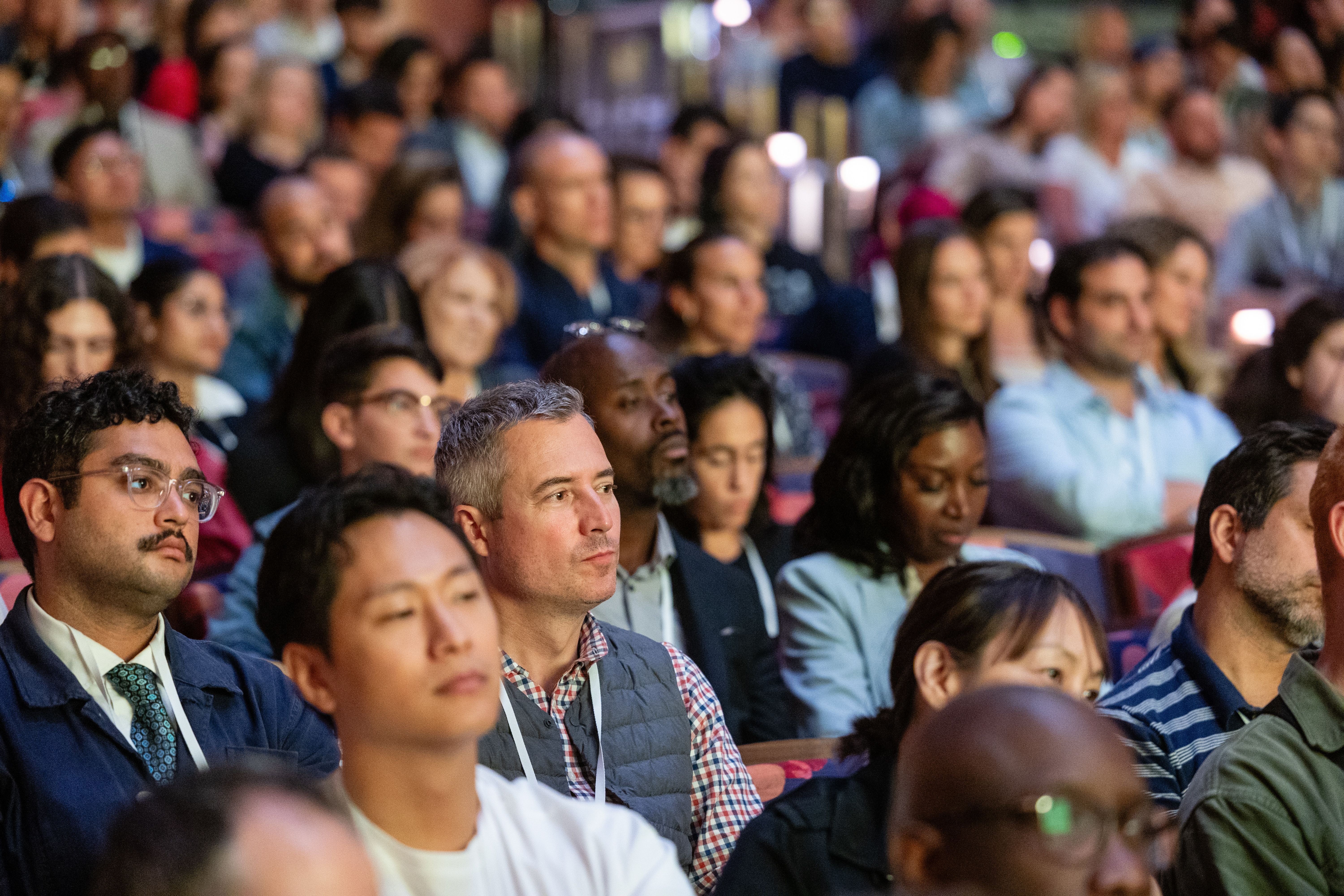Audience at the Welcome Conference watching the stage