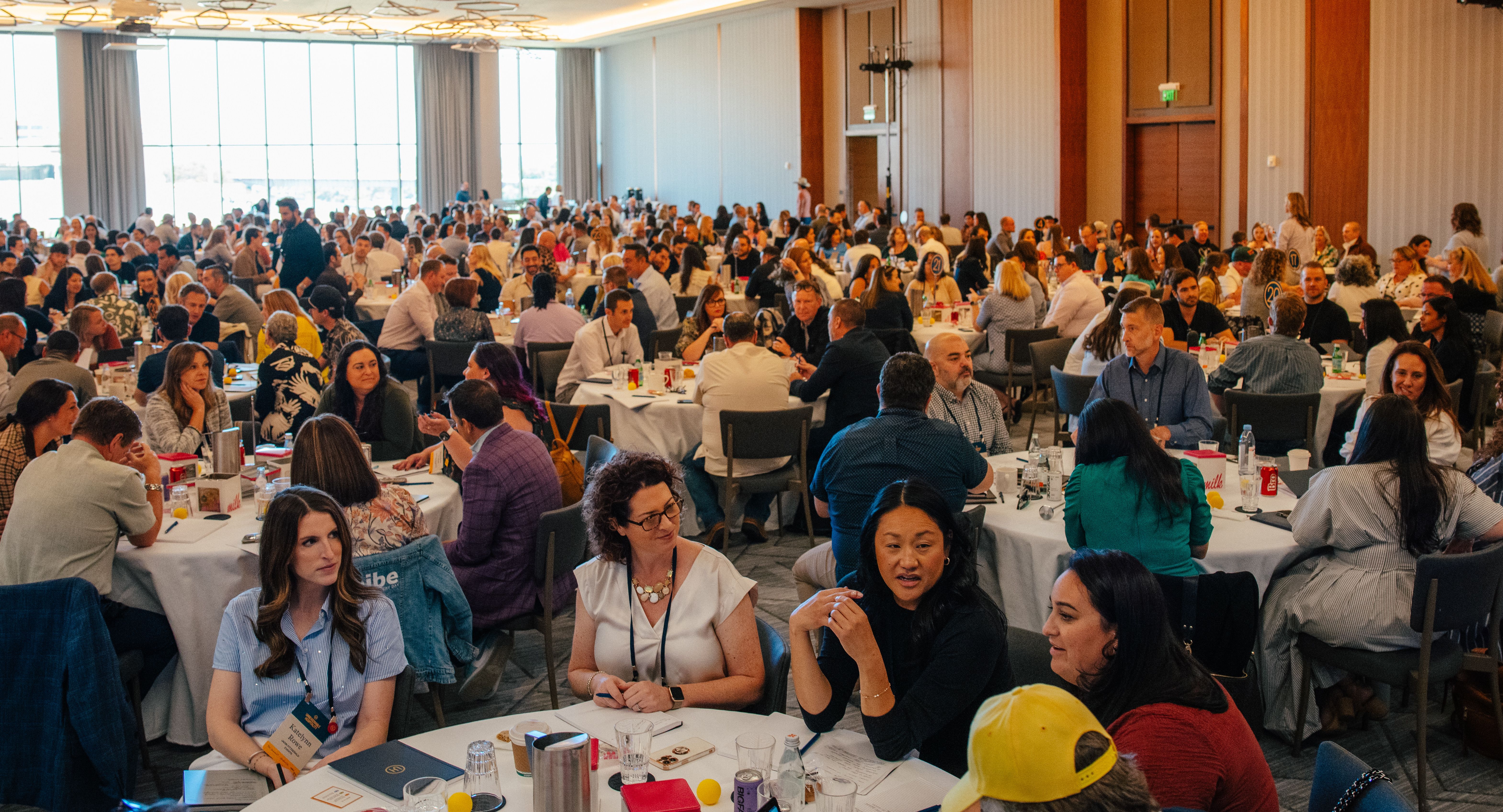 The Summit - a full room shot with attendees at tables