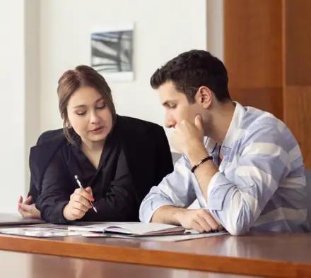 A mentor and a learner reviewing notes