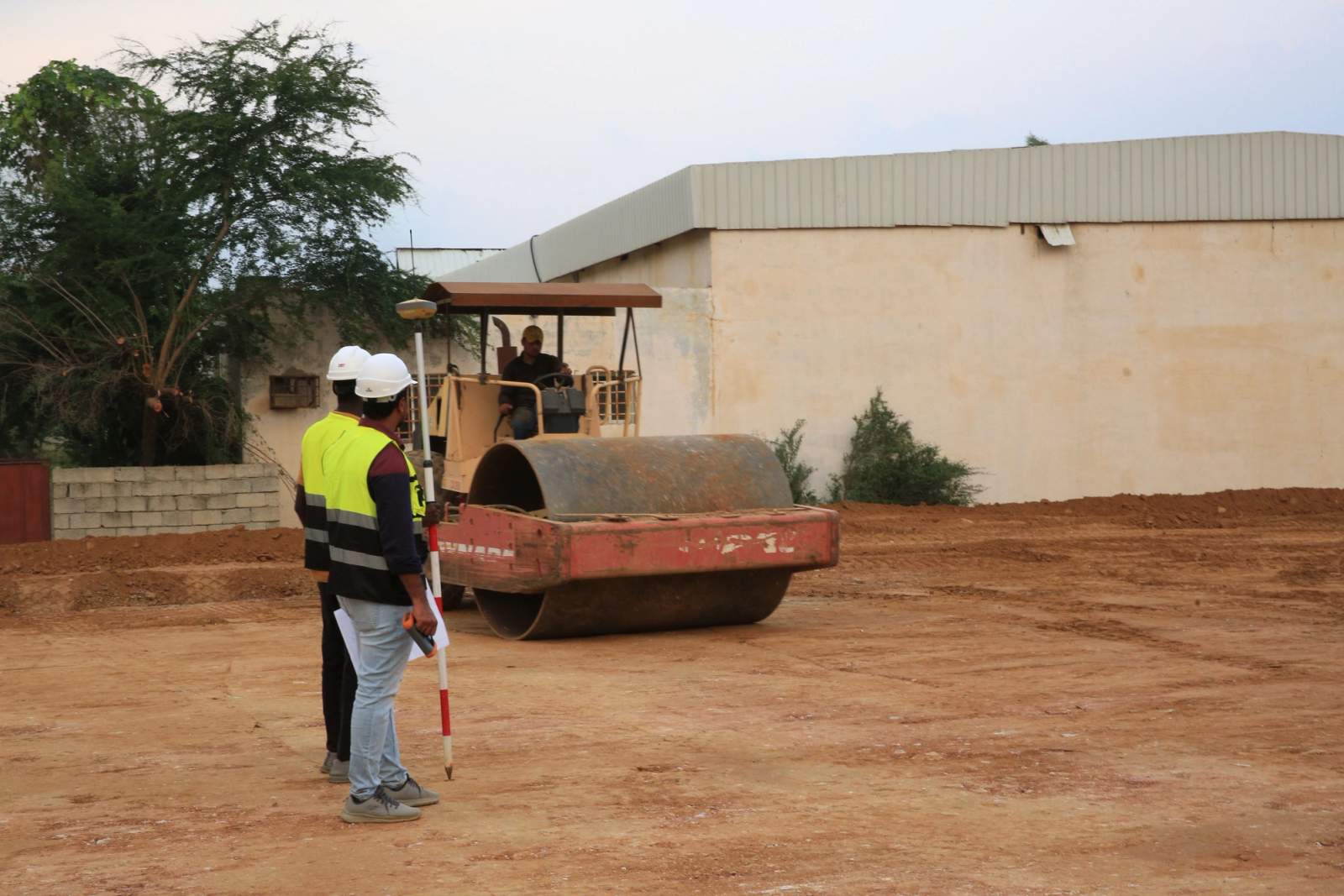 Paving and compaction work on an asphalt site