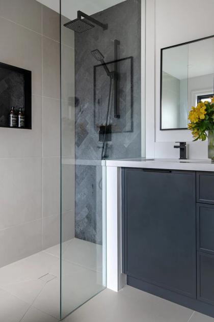 A glass shower enclosure, tiled and sealed