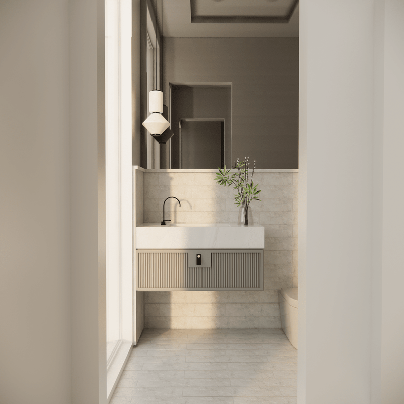 A vanity and mirror in a small bathroom, a sconce either side