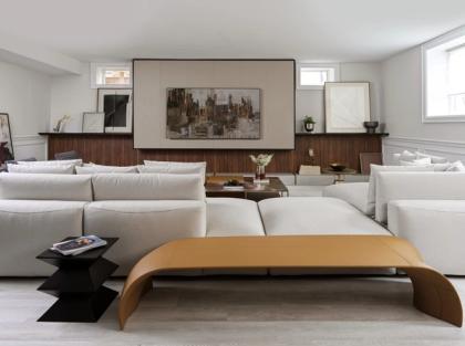 A finished bedroom with a wood-panelled wall