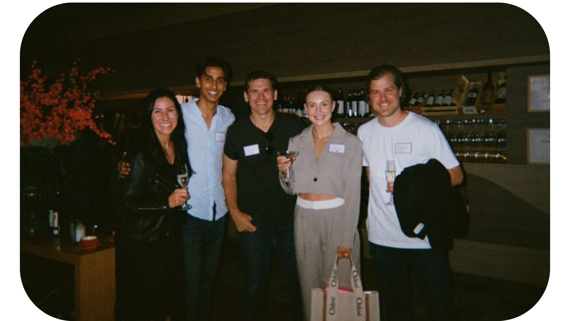 A group of people from Naked Life, Australia's leading non-alcoholic drinks brand, posing for a photo, with one person wearing a name tag labeled Chloe