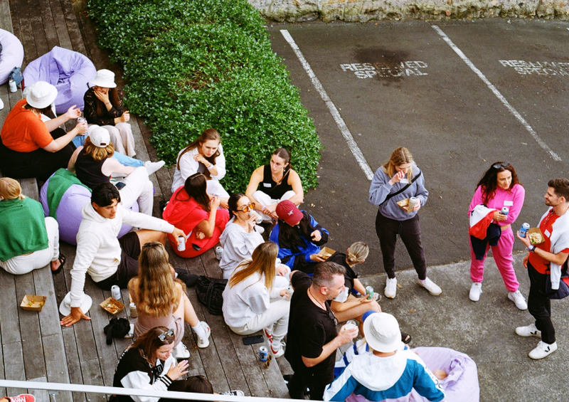 group of people conversing outside taken from high angle shot