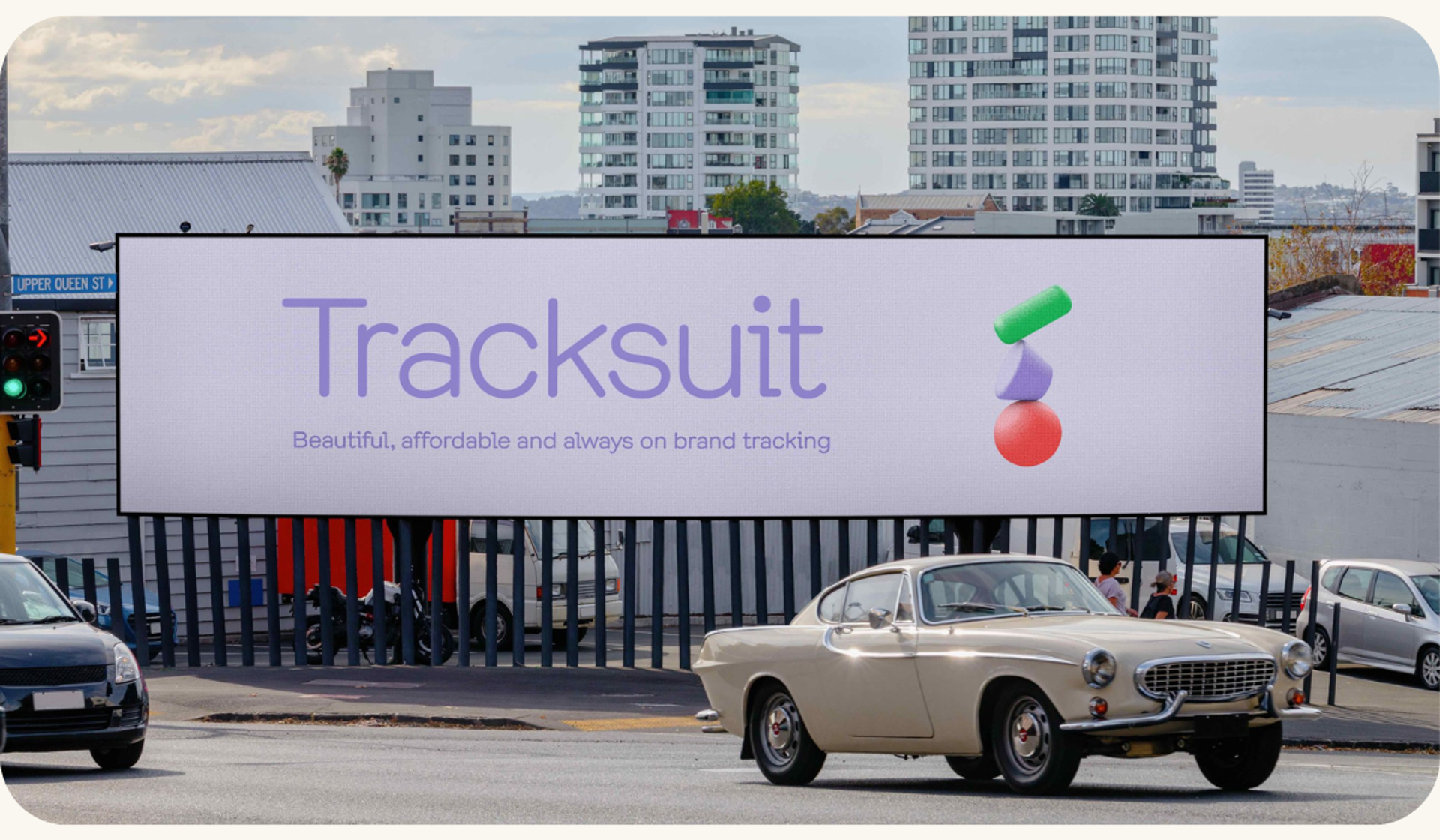 A billboard advertising Tracksuit, a brand health tracking service, emphasizing its qualities of being beautiful, affordable, and always on brand