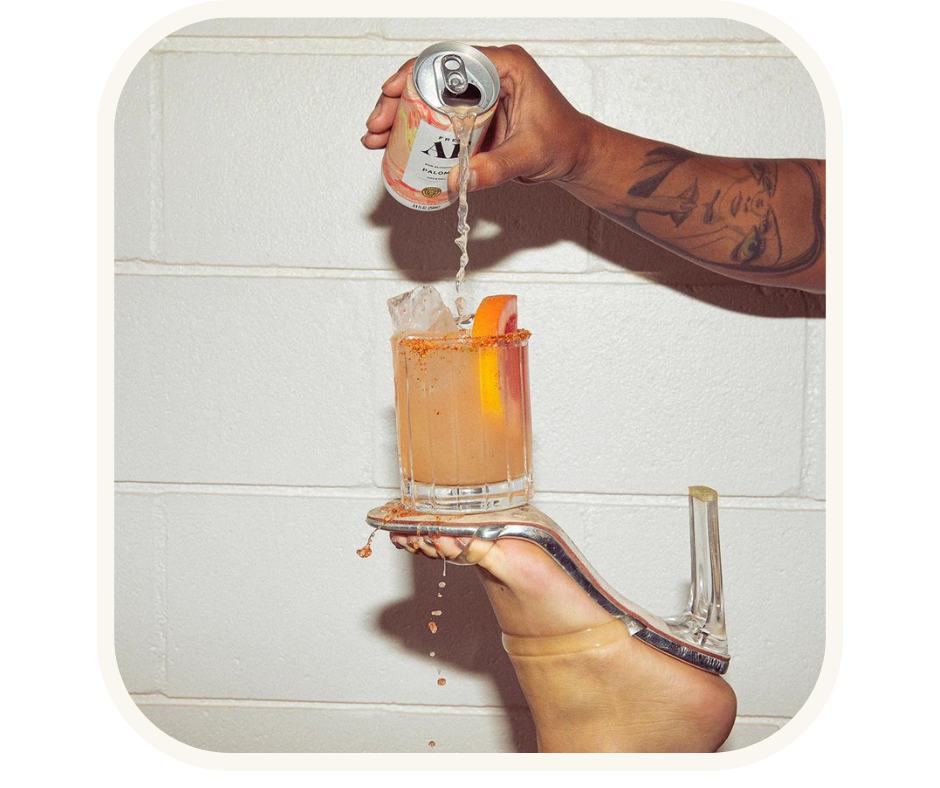 A person pouring a non-alcoholic beverage from a can into a glass, symbolizing the growing trend of alcohol-free drinks