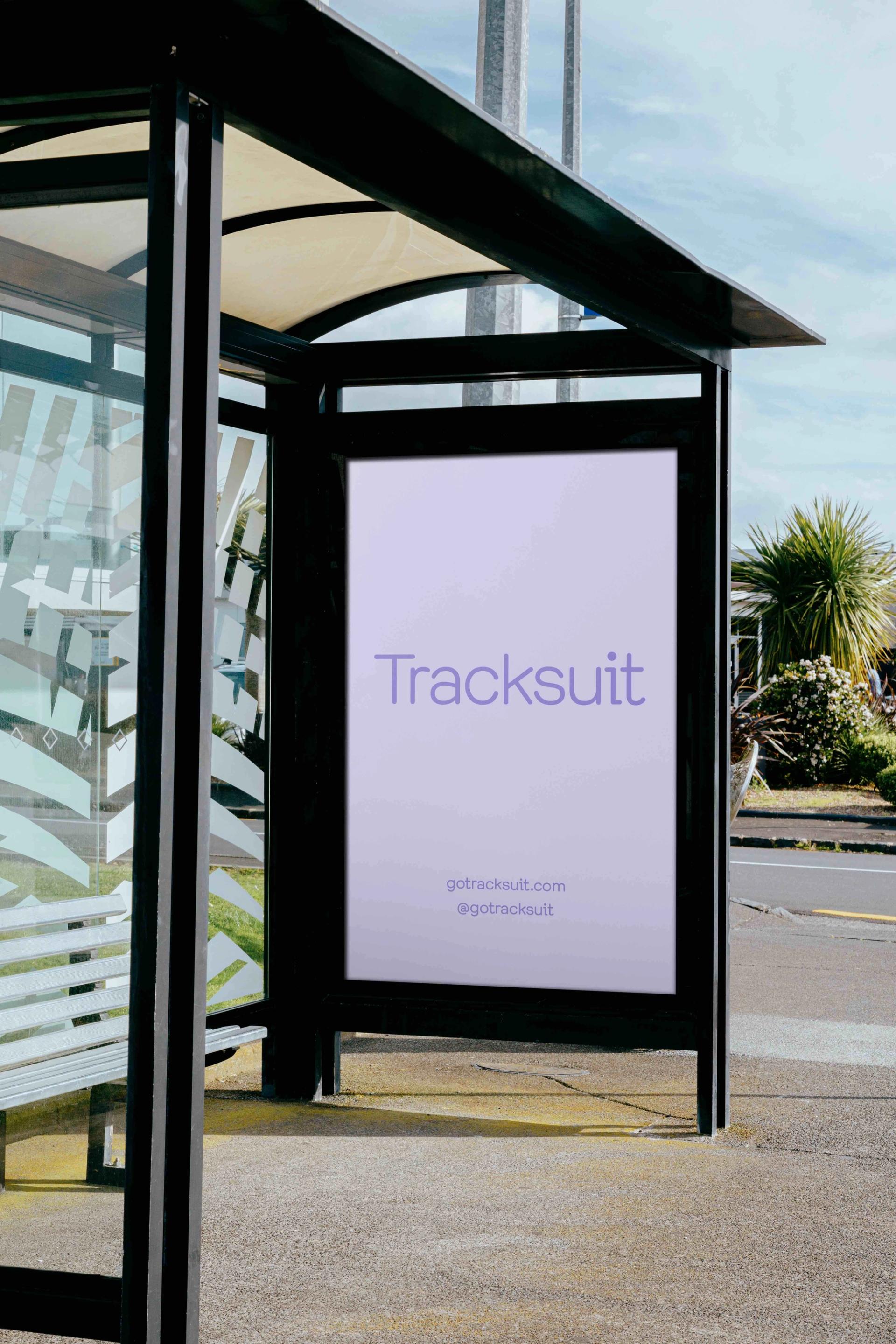 A billboard at a bus stop advertising Tracksuit
