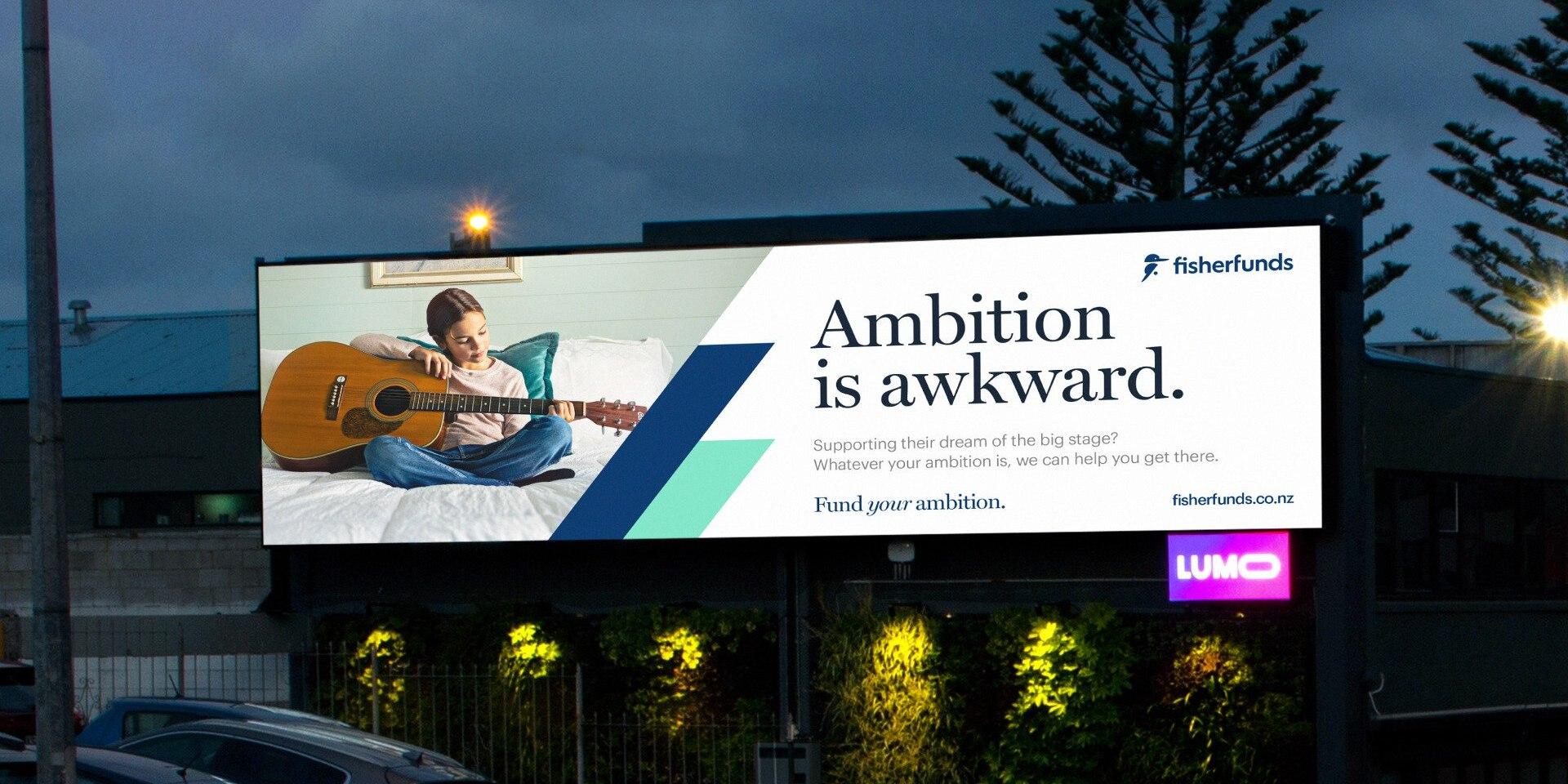 Fisher funds billboard featuring a woman sitting on a bed playing a guitar.