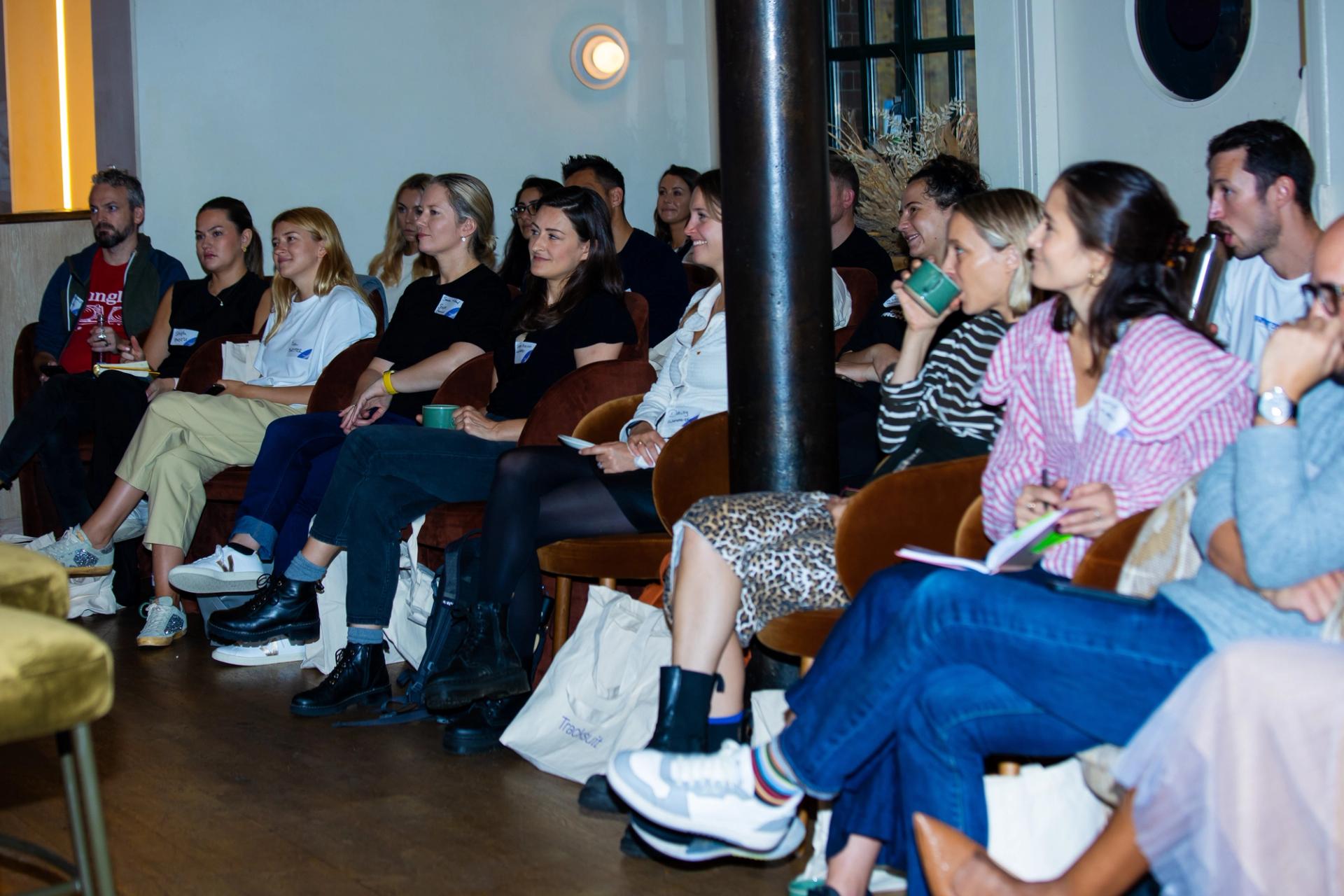 A group of industry professionals attentively watching a presentation on effective brand building strategies at the Building Brands of the Future event in London