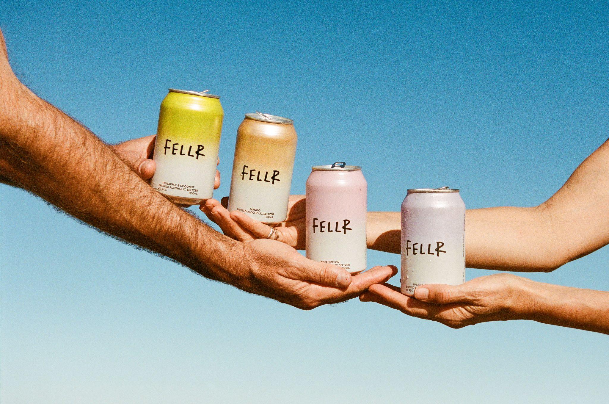 four Fellr cans on a multicoloured pastel background