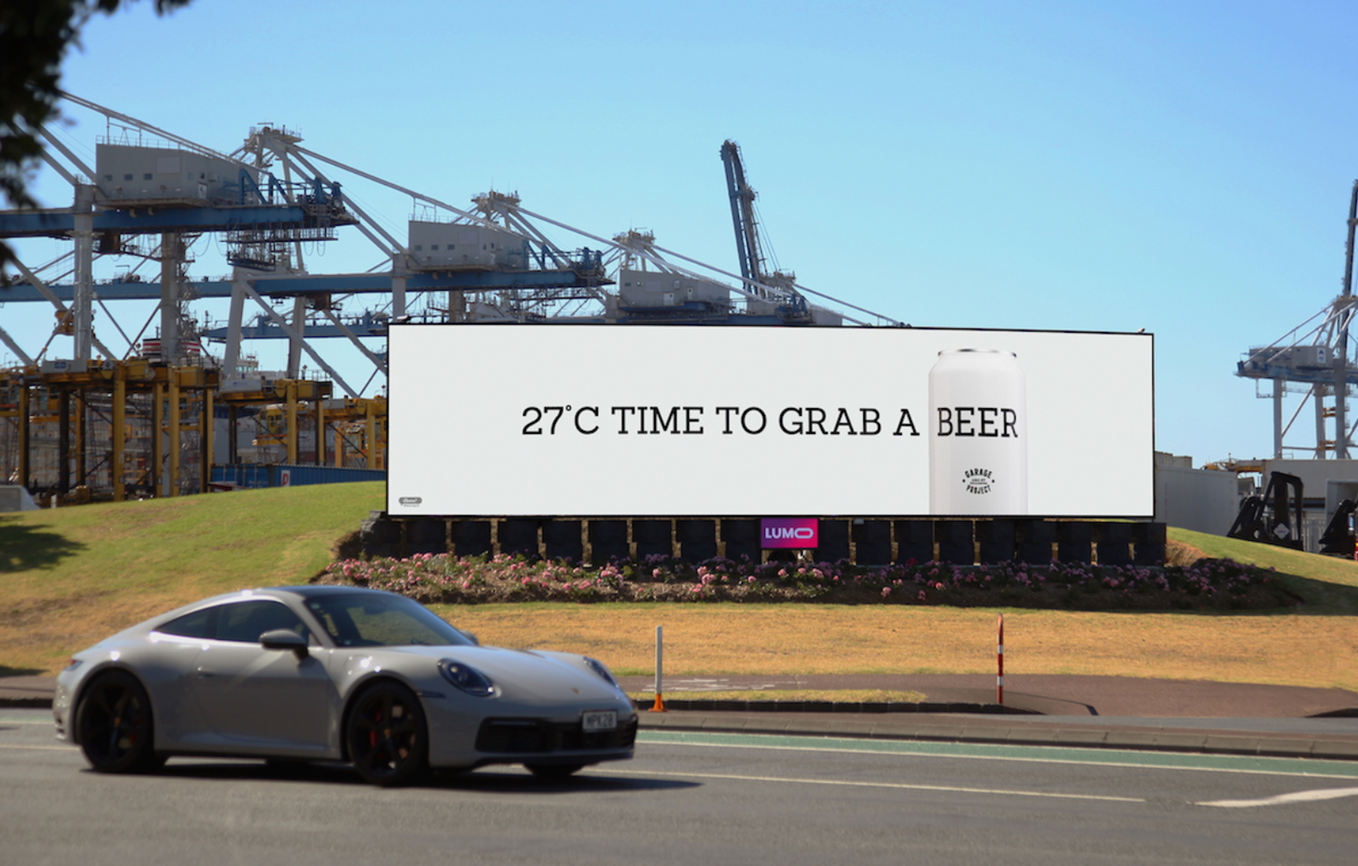 A billboard that says 27°C time to grab a beer