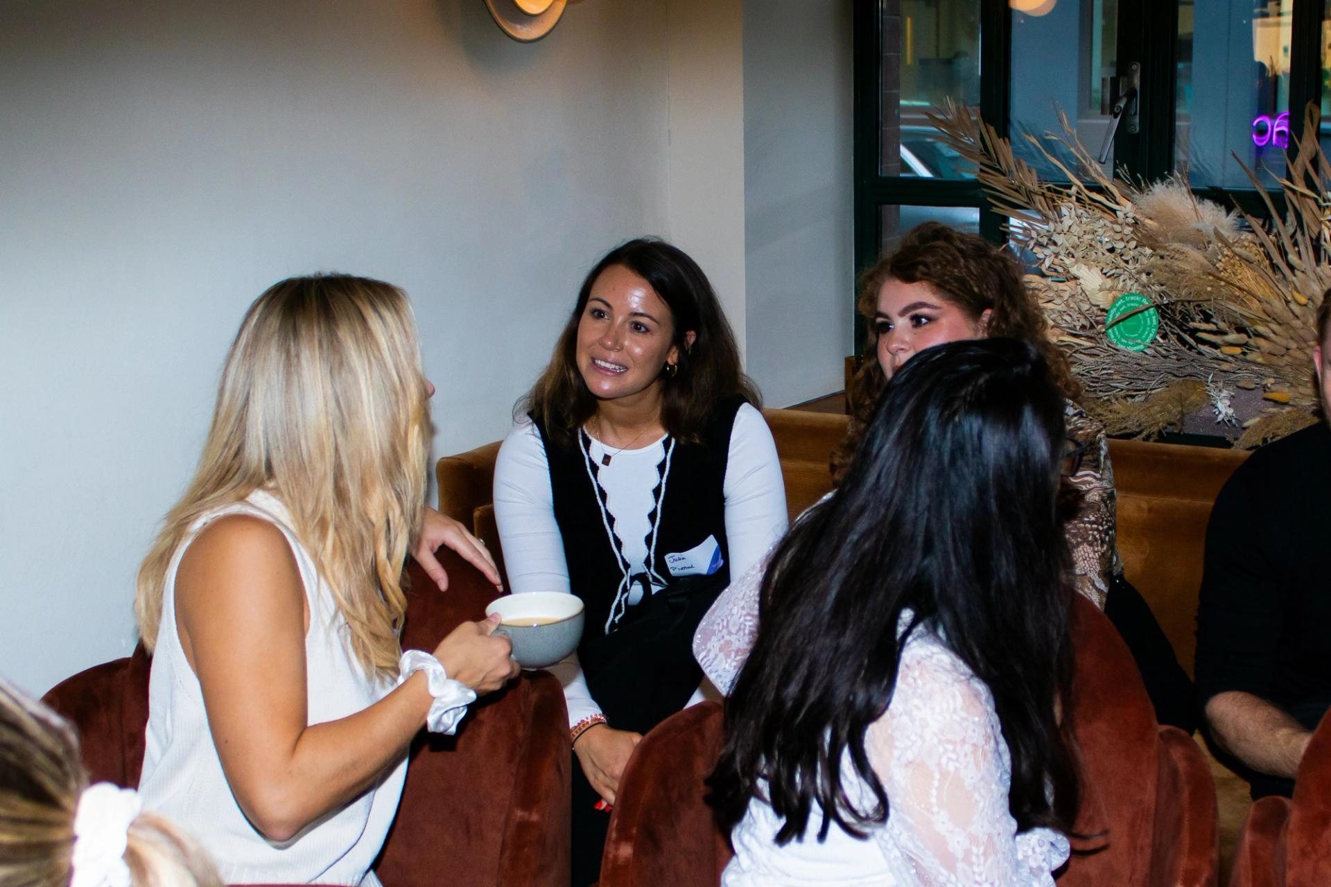 A group of women engaged in a discussion about brand building strategies at the Building Brands of the Future event in London