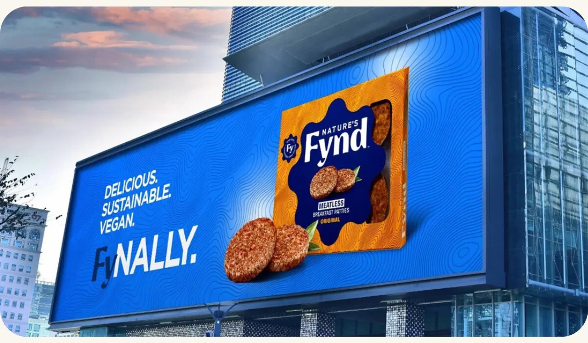 A digital billboard displaying an advertisement for a consumer packaged goods product, specifically a package of food.