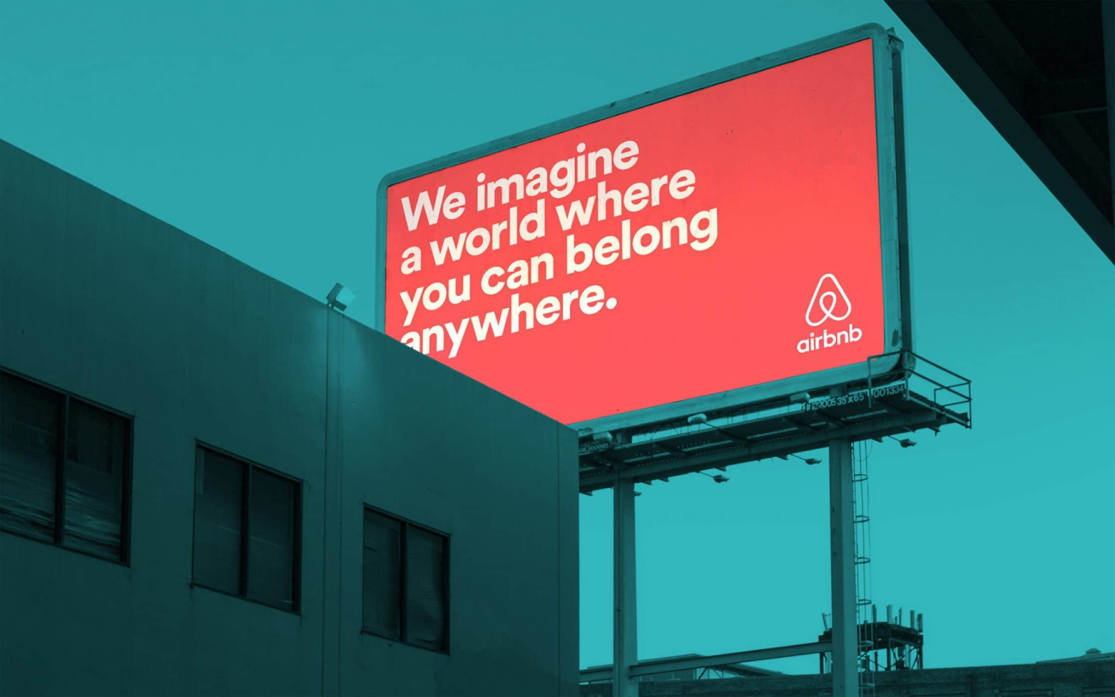 An Airbnb billboard that says we imagine a world where you can belong anywhere