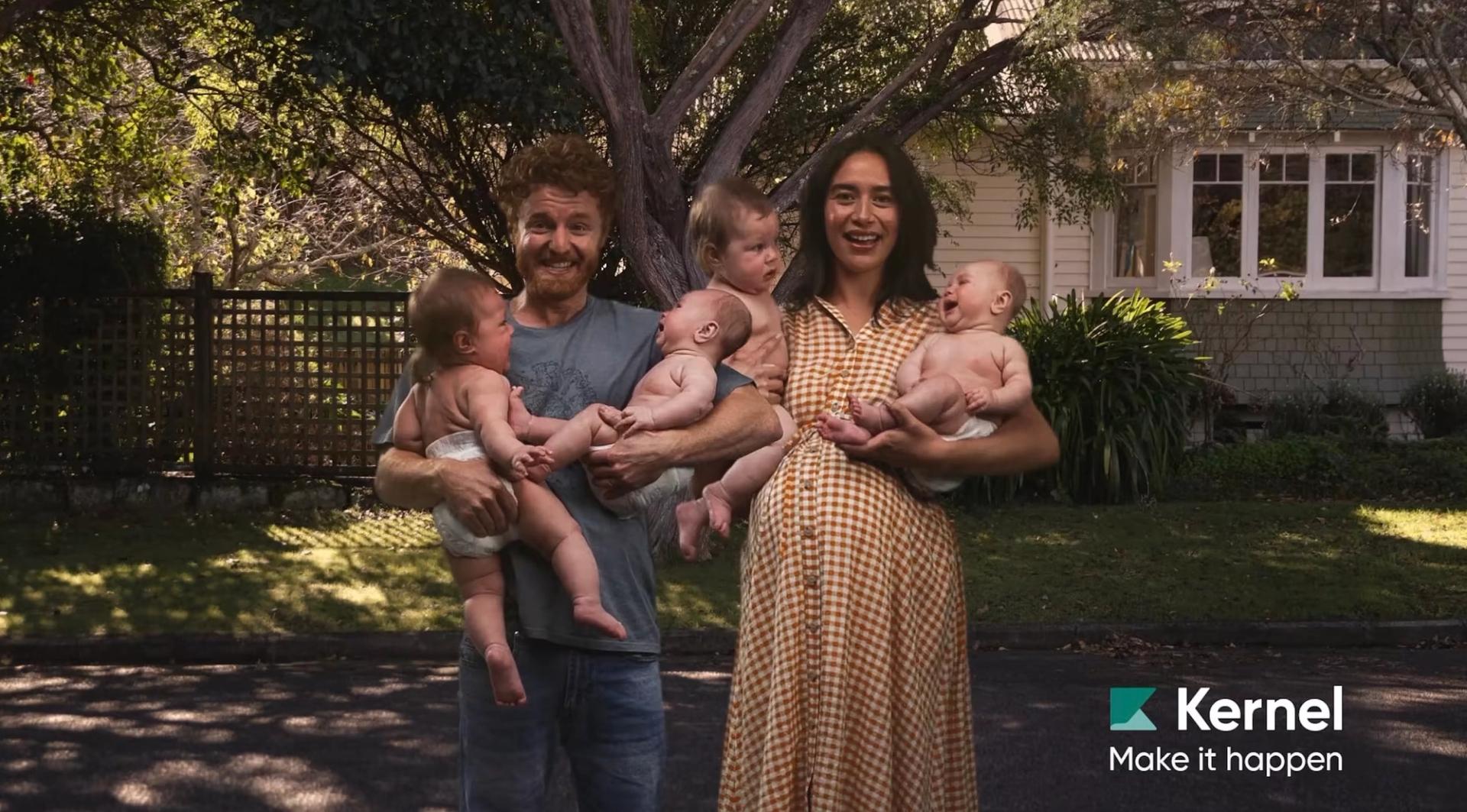 Kernel ad featuring a man and a woman holding four babies