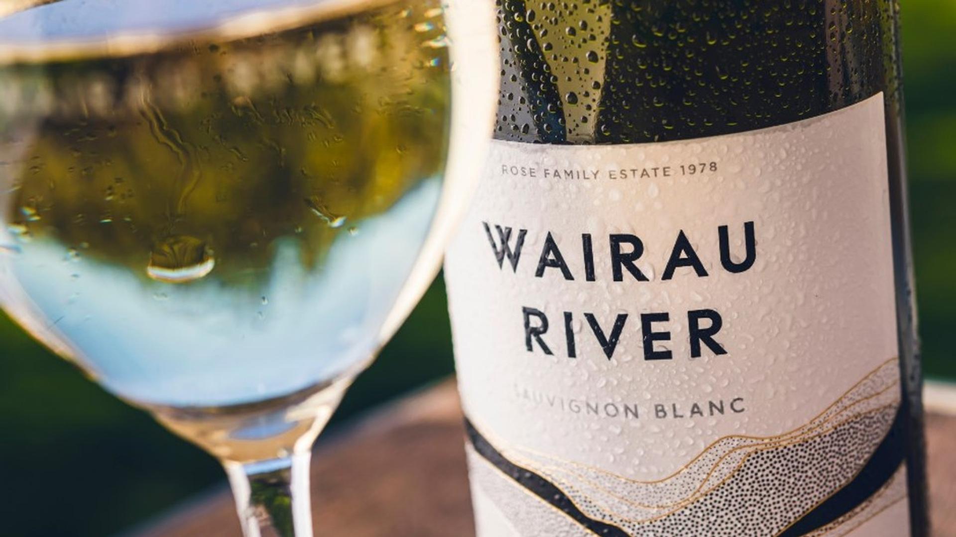 A bottle of Wairau River wine next to a glass of wine